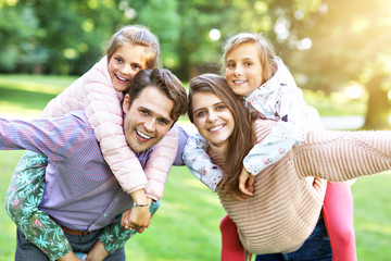 Young family with children having fun in nature