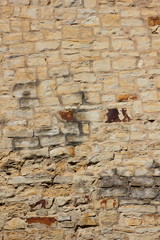 Ancient wall of the medieval city, the wall of an ancient temple in Prague, stone masonry test with cement, blank for designer, background