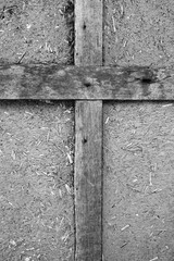 Old brown wooden Old brown wooden cross on a black background