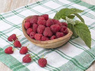 garden raspberry on a kitchen table. 