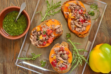 Bruschetta with tuna, tomatoes and sweet peppers with sauce