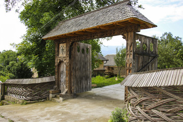 Traditional carved wooden gate in the old vilage Sighetu Marmatiei,Maramures, Romania.