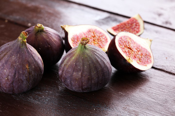 Fresh figs. Food Photo. whole and sliced figs on rustic background.