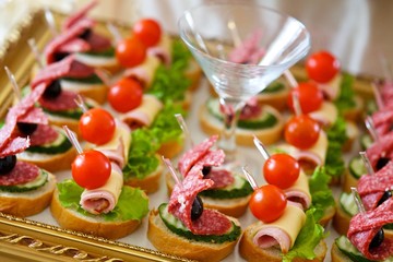 Canape and sandwiches with meat and sausage.
