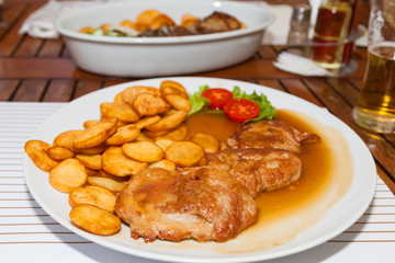 Roast pork dinner with potatoes and gravy