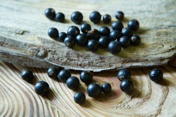 Berries fresh organic black currant lie on a wooden the surface.