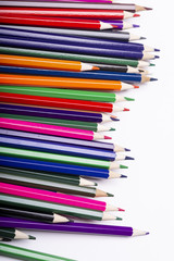 Close-up of colored pencils on white background