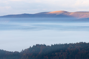 Autumn landscape with fog in the mountains