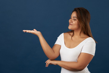 Young woman look on hand palm