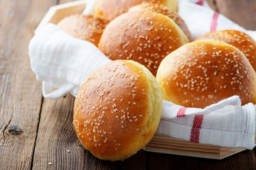 Fresh homemade burger buns with sesame.