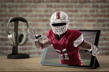 Football Player with a red uniform on a tablet.