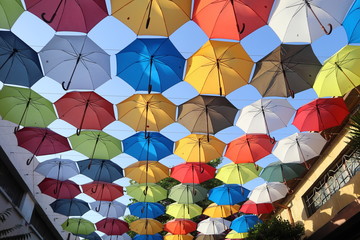 Colourful umbrellas used both as decoration and for providing shade for pedestrians