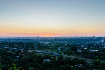 Fototapeta premium The train goes early in the morning around the city.