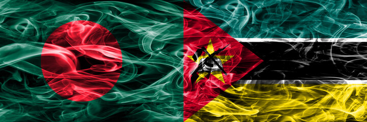 Bangladesh vs Mozambique smoke flags placed side by side. Thick colored silky smoke flags of Bangladesh and Mozambique
