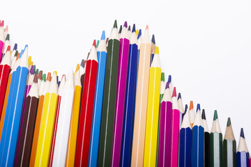 Close-up of colored pencils on white background