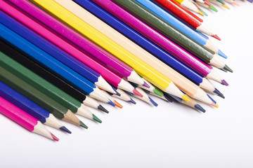Close-up of colored pencils on white background