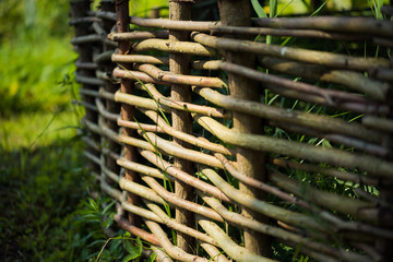ornamental fence made of willow handmade © alipko