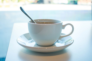 cup of coffee on table with cup of coffee