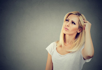 Serious woman looking up in contemplation