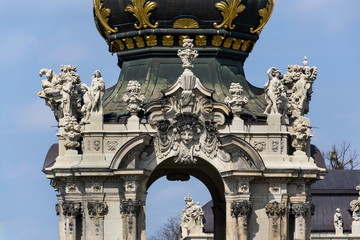 Meeting point Kronentor, crown gate detail at baroque Zwinger palace in Dresden, Germany, sunny day blue sky background