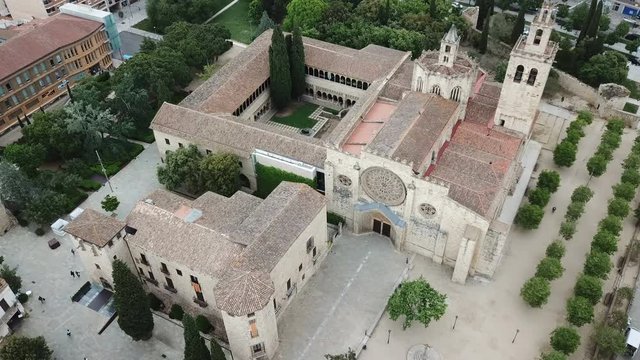 View from drone of ancient Benedictine abbey in Sant Cugat del Valles, Catalonia, Spain