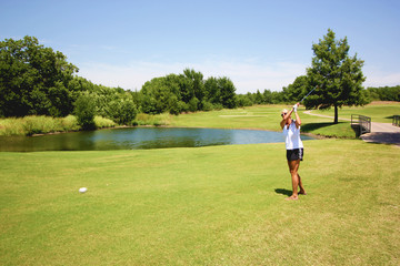 Woman playing golf