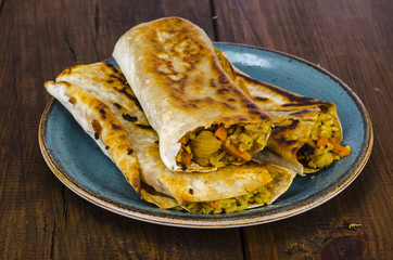 Fast street food. Lavash, shavarma with rice, chicken and vegetables