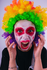 girl in a bright image of a clown. emotional portrait of a student. costumed presentation of...