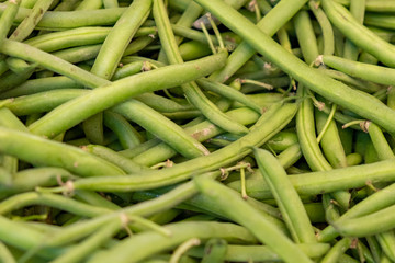 Texture of green and fresh pea pods as a background.