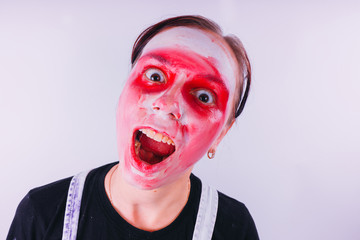 girl in a bright image of a clown. emotional portrait of a student. costumed presentation of...