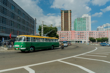 Fototapeta na wymiar Ilyul 2018 - Pyongyang, North Korea - View from the window of a moving car on the central streets of the capital of North Korea - the city of Pyongyang. North Korea is one of the most closed countries