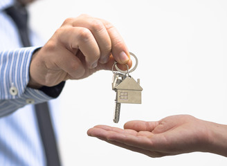 man holding a home key in his hand
