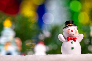 Lovely snowman doll on beautifu background