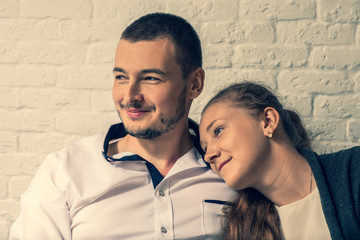 The girl and the man sit in cafe and communicate.