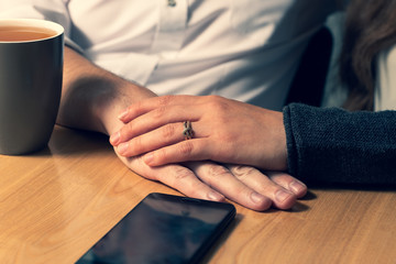 Obraz premium The female hand caresses a male hand.