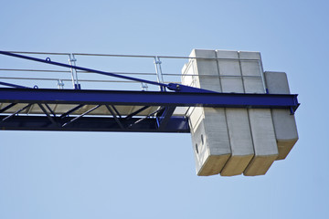 Counterweight on a crane with blue sky