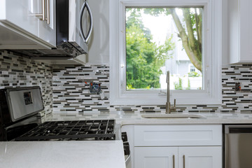 New modern white kitchen Stainless steel sink on the kitchen