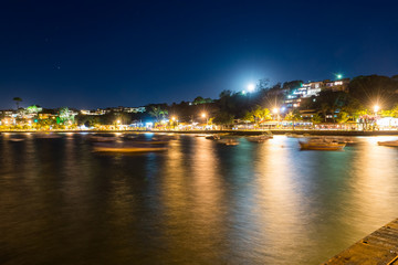 Fototapeta na wymiar The city in twilight time with blurry boats