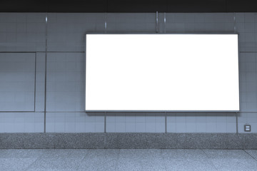 Blank billboard posters in the subway station for advertising.