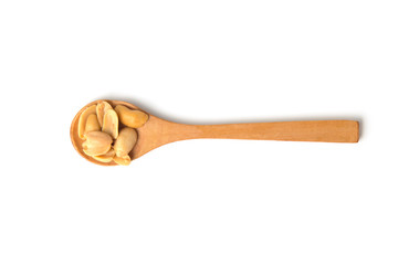 Roasted peanuts in wooden spoon isolated on white background.