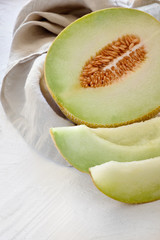 Cantaloupe melone on light textured background