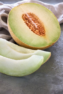Sliced Cantaloupe melone on dark