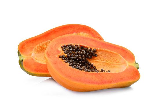 two half cut of ripe papaya with seeds isolated on white background
