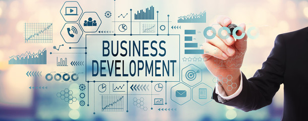 Fototapeta na wymiar Business Development with businessman on blurred abstract background