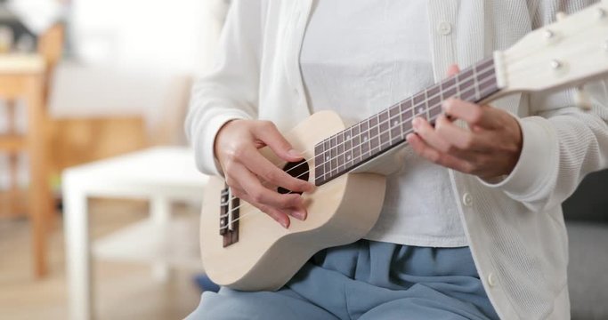 Woman playing ukulele