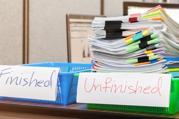 Pile of unfinished document on office desk. Stack of homework assignment archive with colorful...