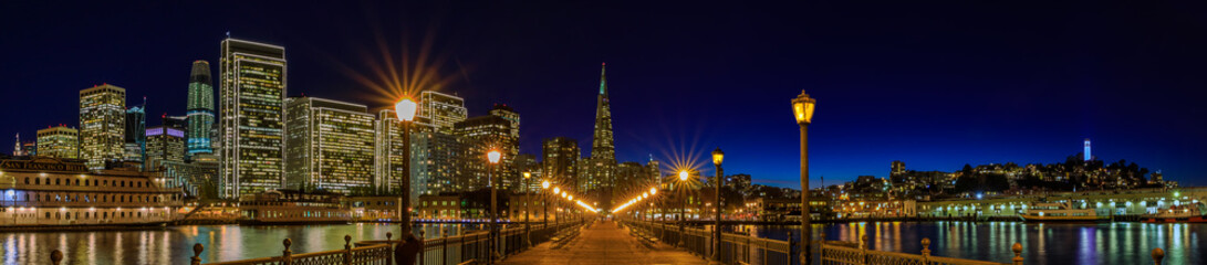 Fototapeta na wymiar Downtown San Francisco and the Transamerica Pyramid at Christmas from wooden Pier 7 at sunset