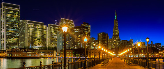 Downtown San Francisco and the Transamerica Pyramid at Christmas from wooden Pier 7 at sunset