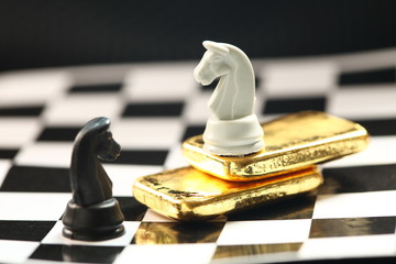 Gold bar on chess board scene.