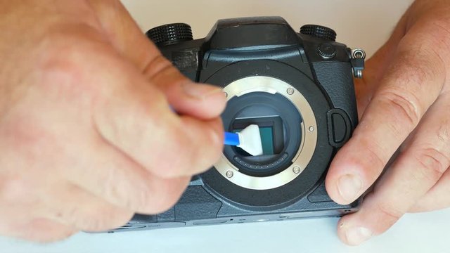 Cleaning the camera matrix. dust on the matrix. dirt on the sensor. sensor cleaning. photosensitive matrix.
